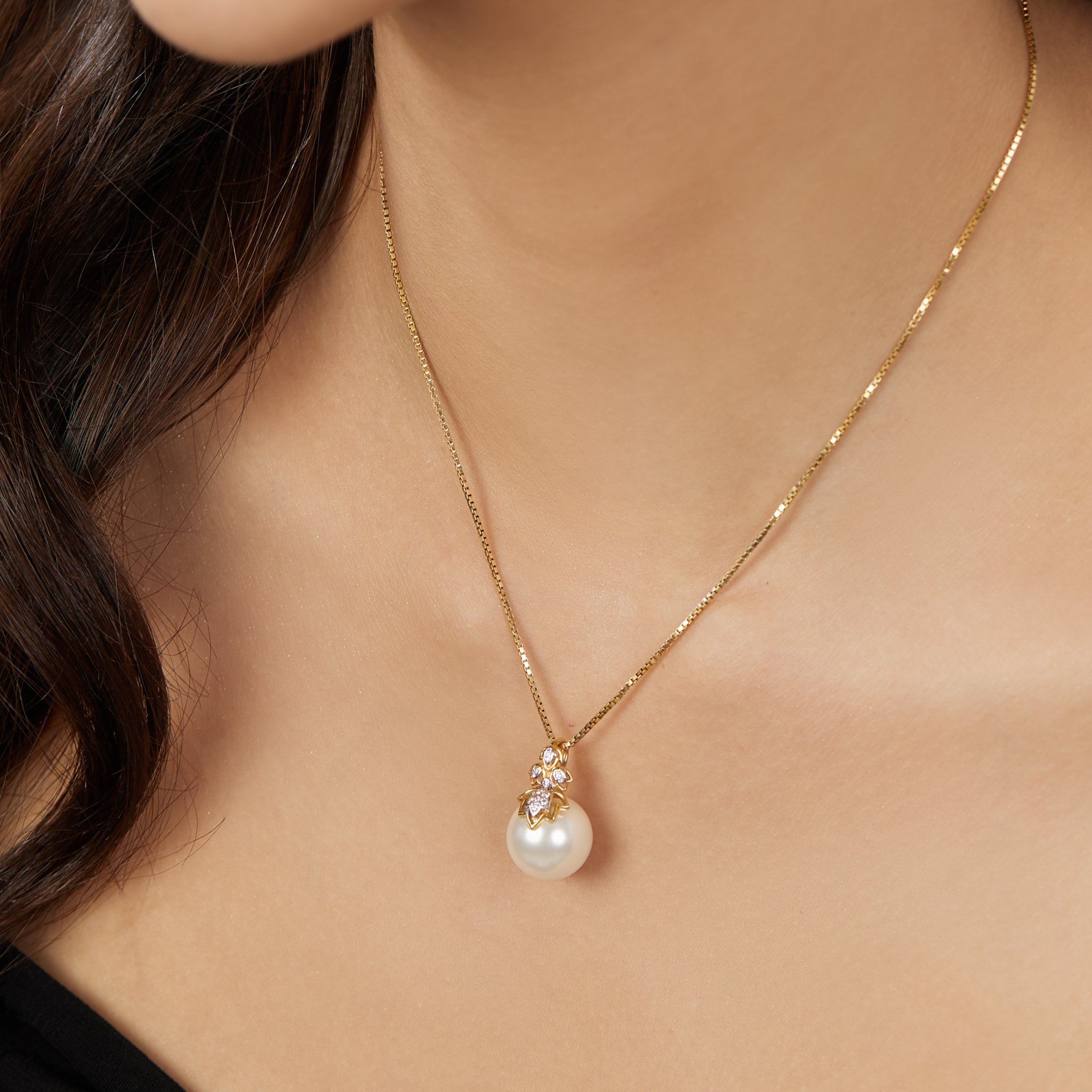 The inverted lotus diamond and pearl pendant