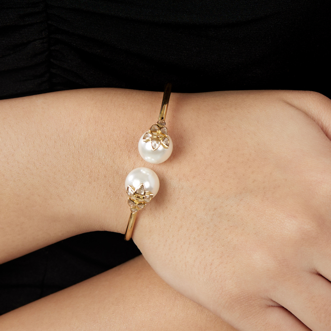 The classic 6 petal rosecut diamond and pearl bangle