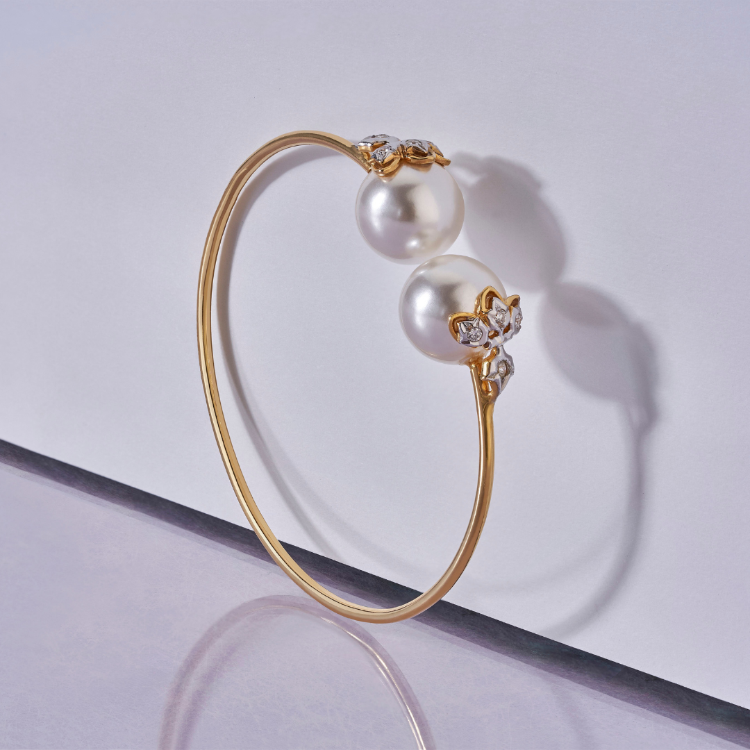 The lotus loop diamond and pearl bangle