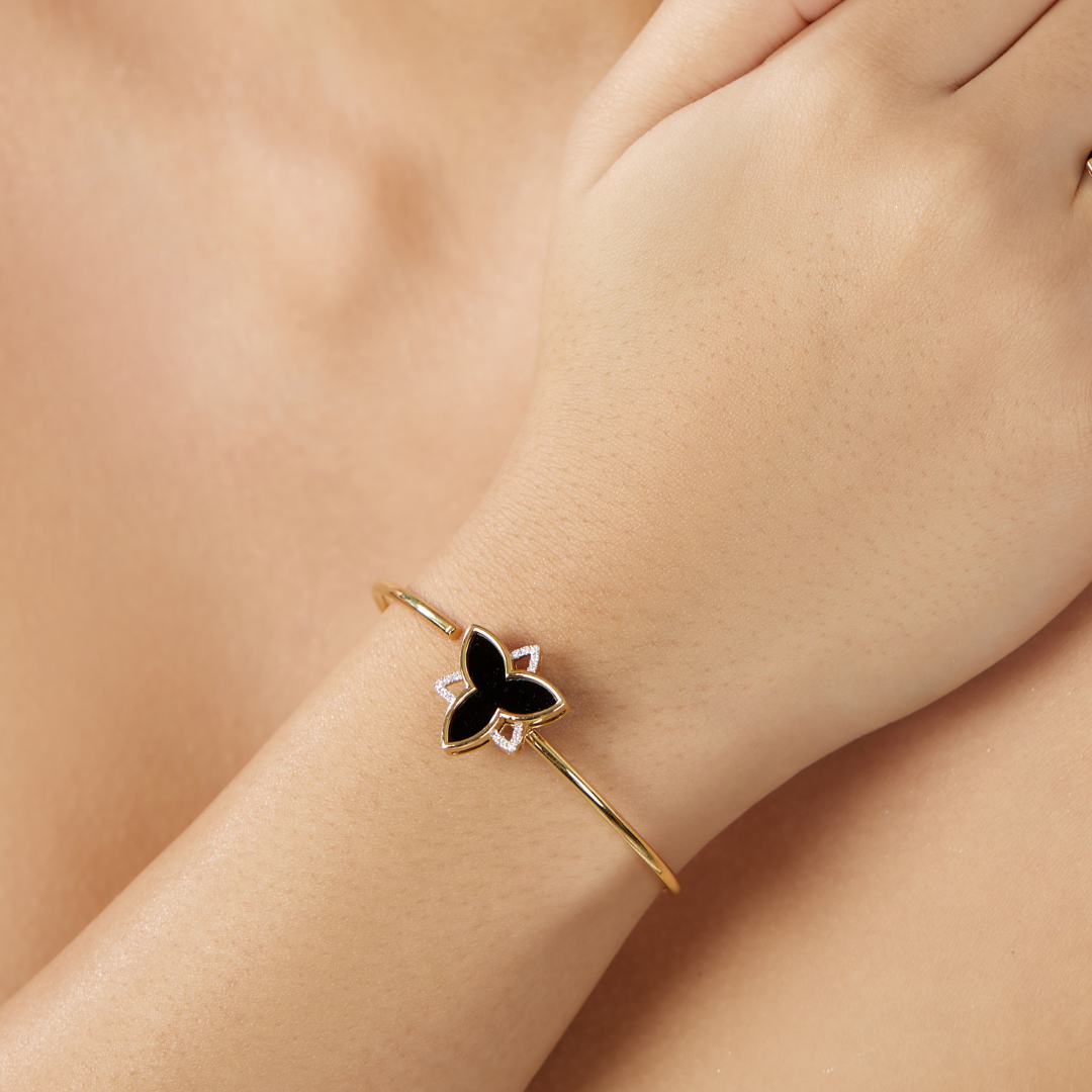 The classic black large trillium bangle with diamonds